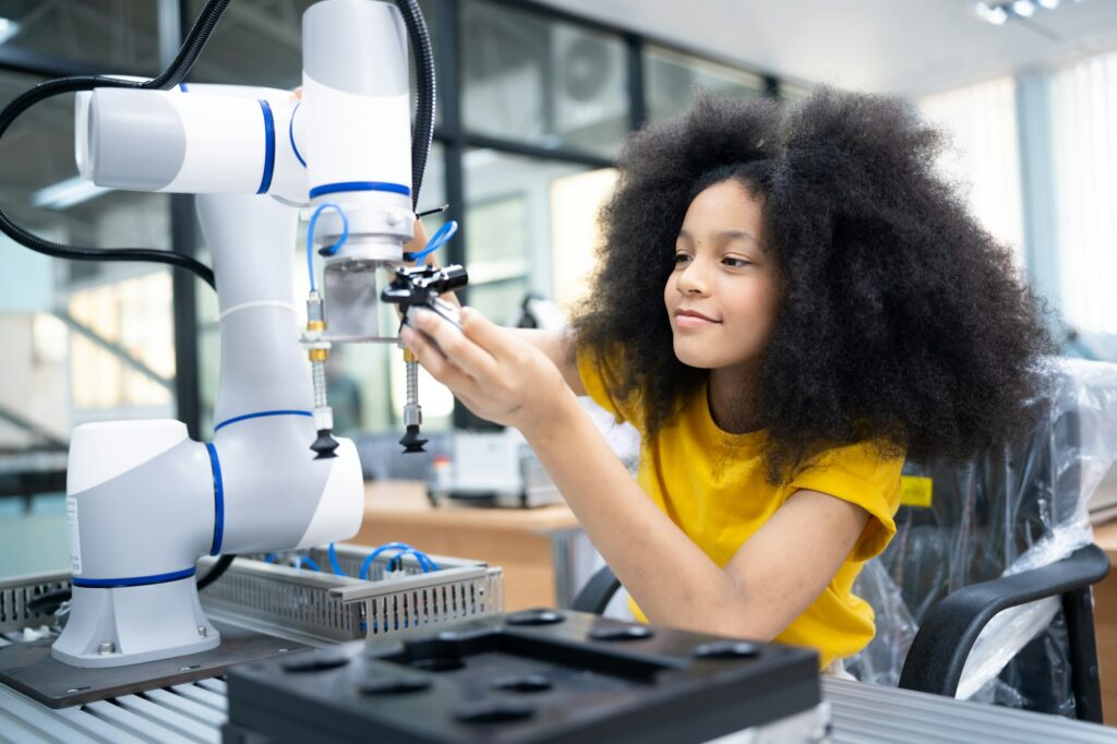 Student working with robot for science project. Students studying robotic at an university institute