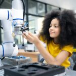 Student working with robot for science project. Students studying robotic at an university institute